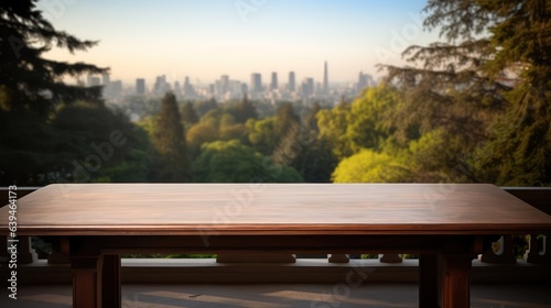 The empty wooden table top with blur background of the downtown business district.