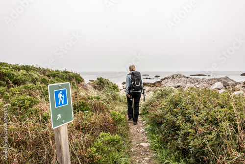 Exploring the beach in the mist morning at Kejimkujik National Park Seaside, Nova Scotia, Canada photo