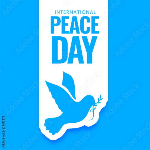 papercut style world peace day poster with dove bird and olive leaf
