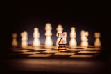 Chess pieces with king teamwork concepts of leadership or wining challenge strategy and battle fighting of business team player and risk management or human resource or strategic planning.