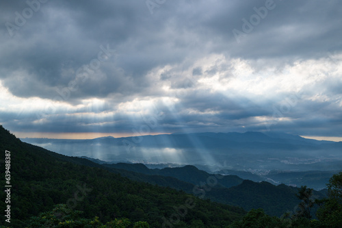 Heavenly Glows: Watch Crepuscular Rays amidst Transforming Clouds on the Peak. The Wufenshan Weather Radar Station stands on the top of the mountain. Taiwan