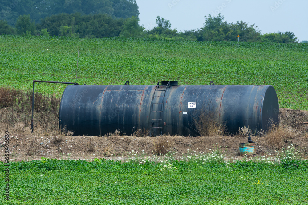 Crude oil machine pumping oil in the fields of Ontario, Canada. Crude oil machine pumping oil in the fields of Ontario, Canada.