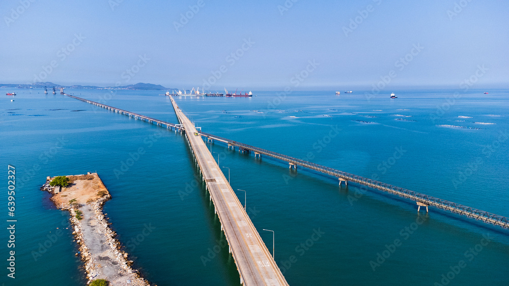 Cargo ship Transportation and Tug boat cargo ship leaving harbor in deep sea port at industrial estate for import export around in the world Cargo ship Transportation and Tug boat cargo ship leaving harbor in deep sea port at industrial estate for import export around in the world