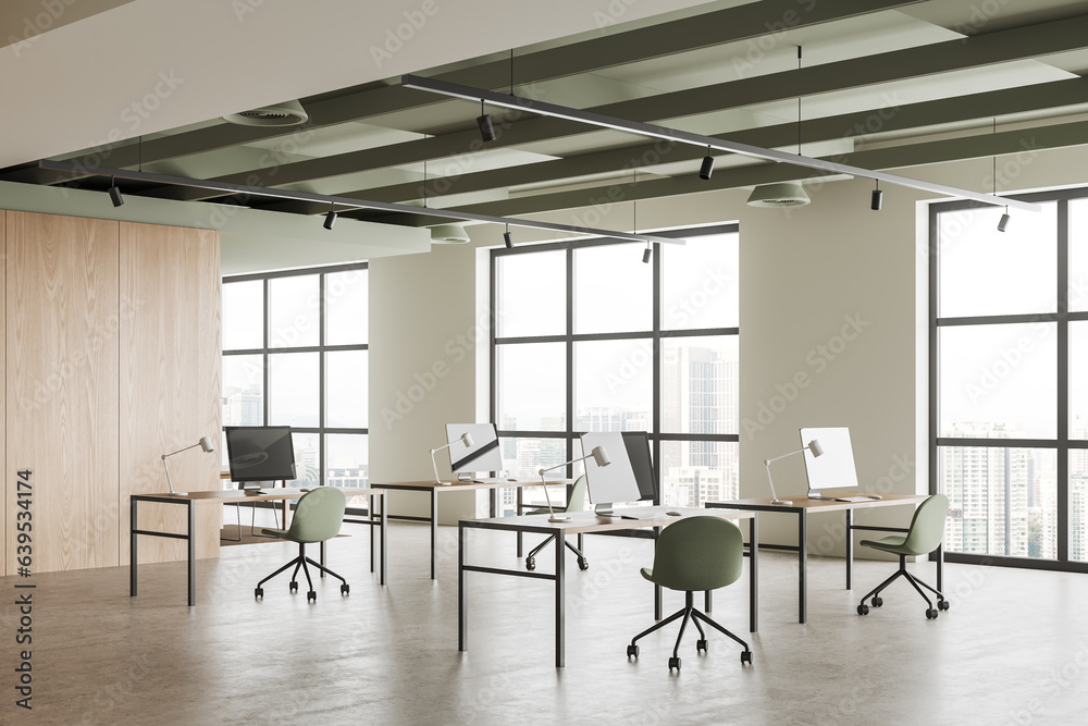 Stylish coworking interior with pc computer and armchairs, window Stylish coworking interior with pc computer and armchairs, window