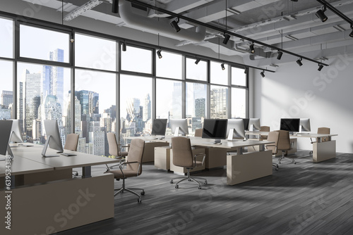 Modern office interior with pc monitors in row, chairs and panoramic window