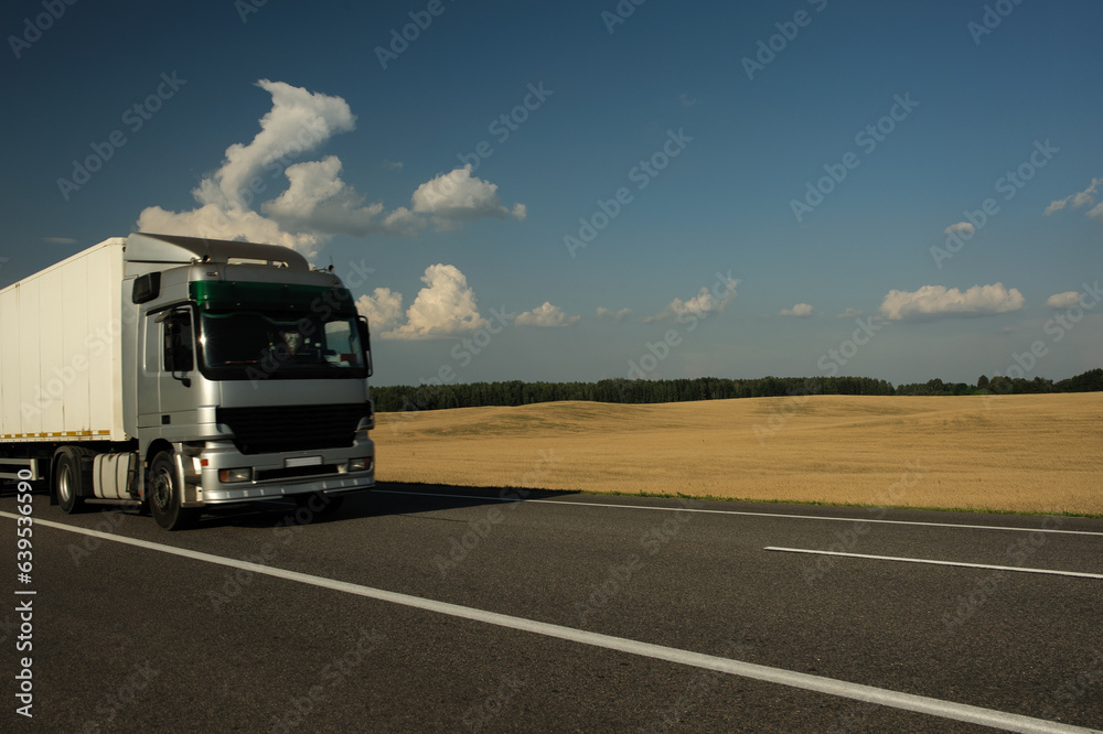 the truck rides against the backdrop of a beautiful landscape