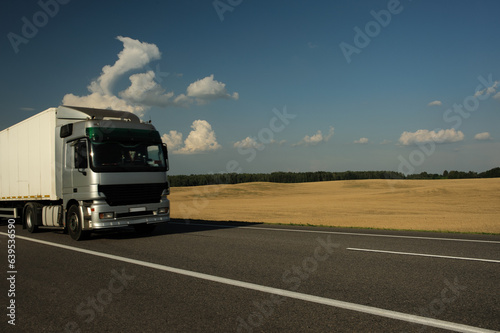 the truck rides against the backdrop of a beautiful landscape