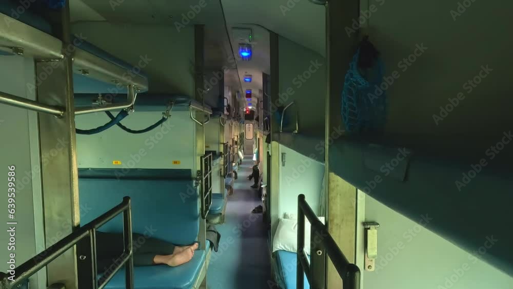 Inside interior of a sleeper class coach of the Indian railway high speed train without passengers.