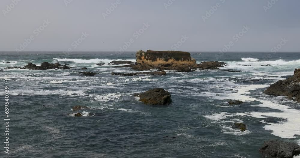 Fort Bragg glass beach rocky coast surf California. Eco Tourism and family vacation. Rugged rocky cliffs pounded by beautiful surf. Ocean shoreline coastal landscape. Fort Bragg glass beach rocky coast surf California. Eco Tourism and family vacation. Rugged rocky cliffs pounded by beautiful surf. Ocean shoreline coastal landscape.