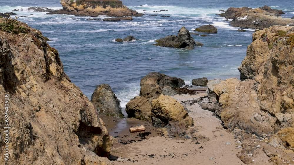 Fort Bragg glass beach rocky cove beach California. Eco Tourism and family vacation. Rugged rocky cliffs pounded by beautiful surf. Ocean shoreline coastal landscape. Fort Bragg glass beach rocky cove beach California. Eco Tourism and family vacation. Rugged rocky cliffs pounded by beautiful surf. Ocean shoreline coastal landscape.