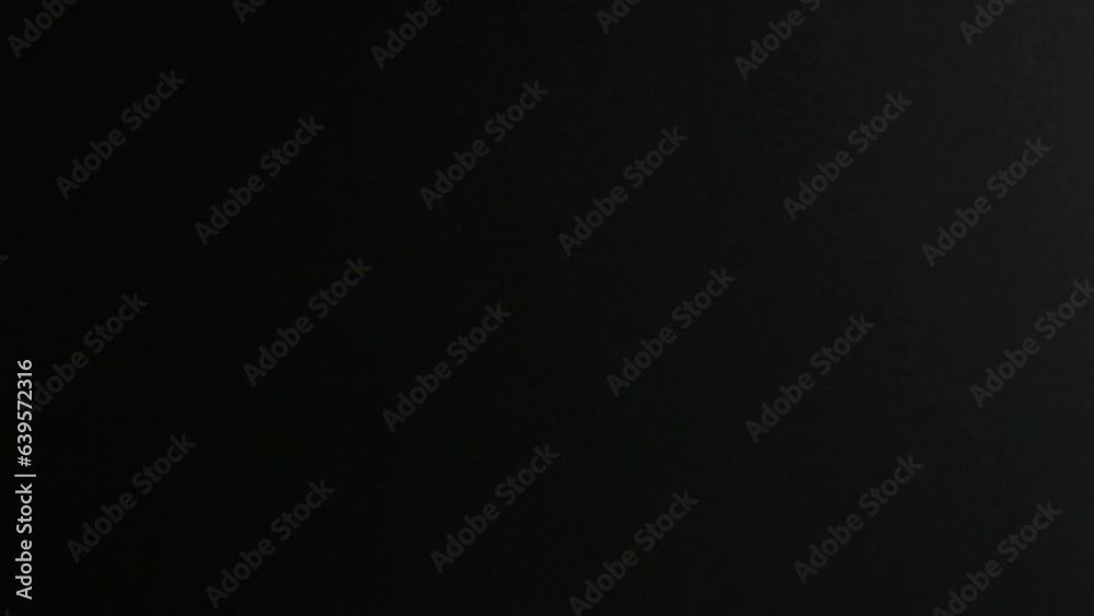 Many multi-colored soap bubbles on a black background in slow motion Many multi-colored soap bubbles on a black background in slow motion