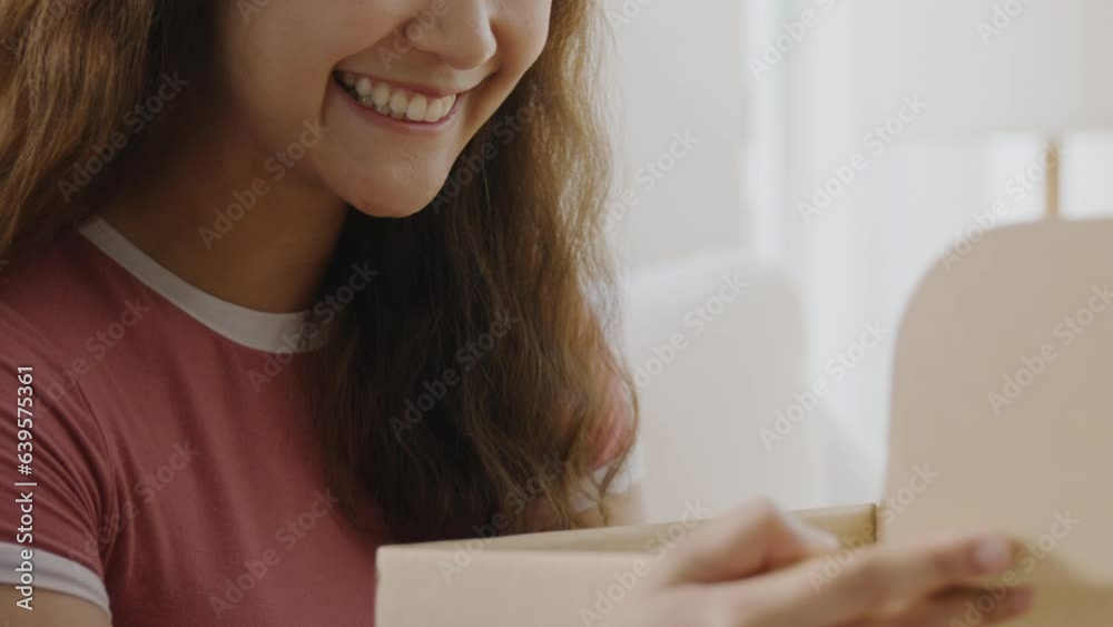 Asia people young Gen Z woman smile open unbox unpack parcel box goods carton packaging happy joy face. Omni channel enjoy buy gift order postal at retail online shop store send courier home service.