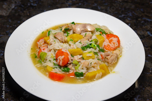 Traditional chicken soup with vegetables typically served in hospitals