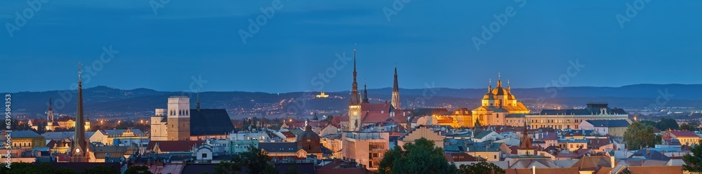 Panoramic, very detailed, evening  cityscape. Illuminated historical centre of city Olomouc in blue hour, UNESCO site, ancient town and tourist spot in Central Moravia, Czech Republic.
