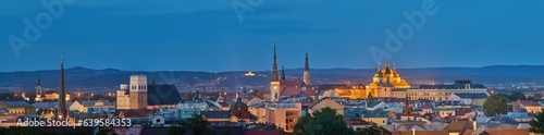 Panoramic, very detailed, evening cityscape. Illuminated historical centre of city Olomouc in blue hour, UNESCO site, ancient town and tourist spot in Central Moravia, Czech Republic.