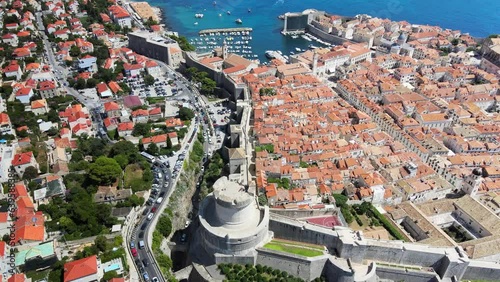 A camera drone flies sidewise above Dubrovnik Old Town, Croatia photo