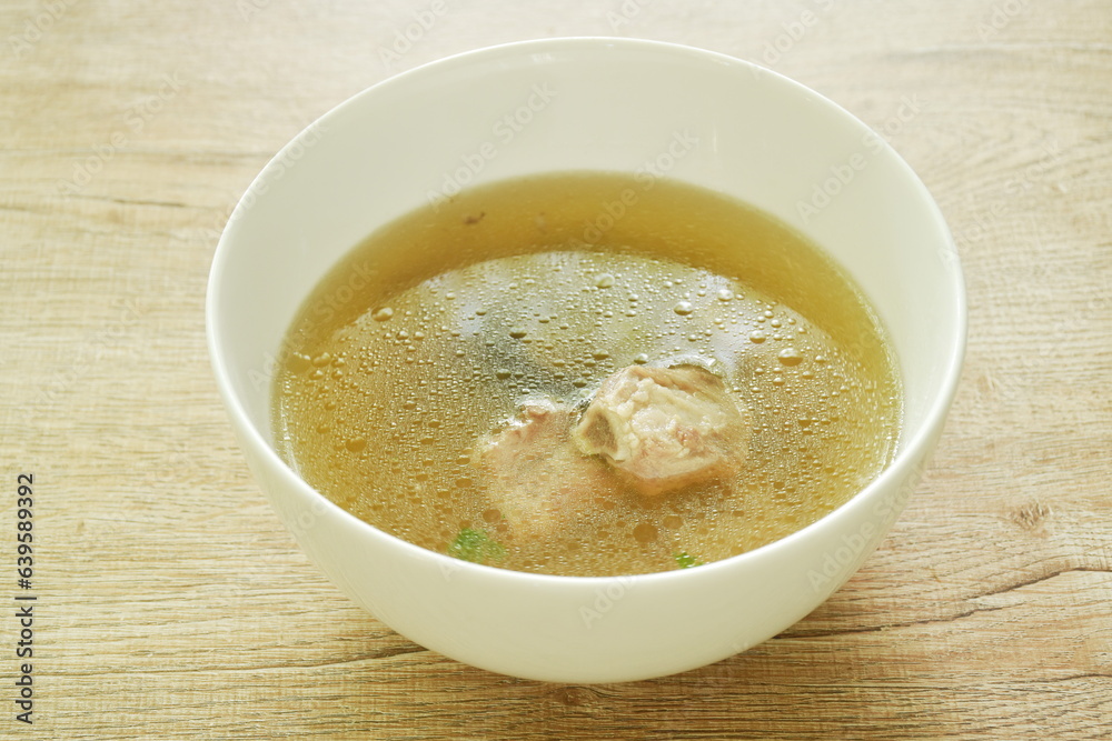 boiled chop braised pork bone with black mushroom in Chinese herb soup on bowl boiled chop braised pork bone with black mushroom in Chinese herb soup on bowl