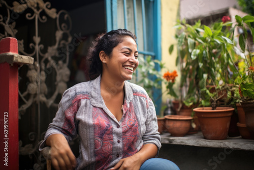 Happy smiling Hispanic woman in the backyard of her house in Mexico 