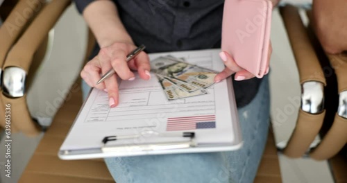 Students applying for American visa with dollar money and passports. Group interview at US consulate photo