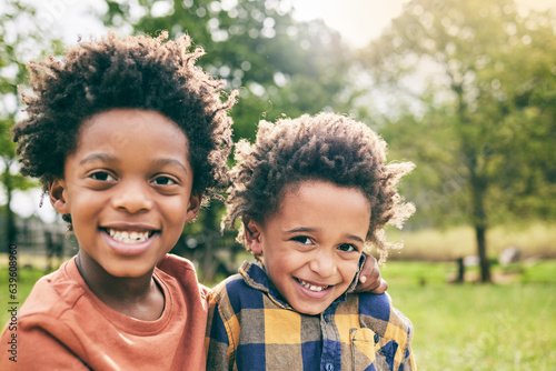 Photos Portrait, boy and brothers hug outdoor in garden, park and nature for fun, good mood and happy