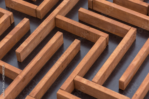 brown wooden maze on dark dirty background