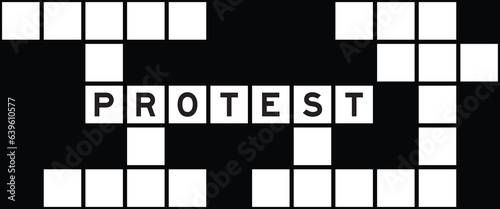 Alphabet letter in word protest on crossword puzzle background