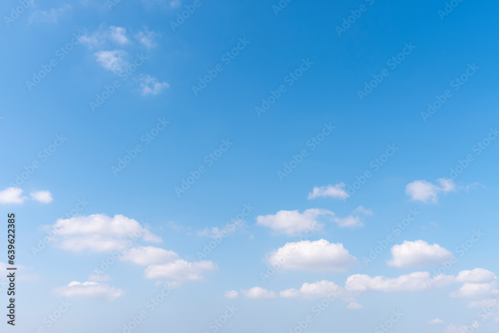 Blue sky and white fluffy tiny clouds background and pattern Blue sky and white fluffy tiny clouds background and pattern