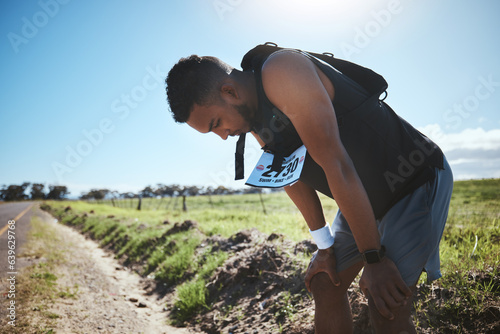 Obraz na płótnie Fitness, breathing and tired man in road for training, workout or intense cardio outdoor performance