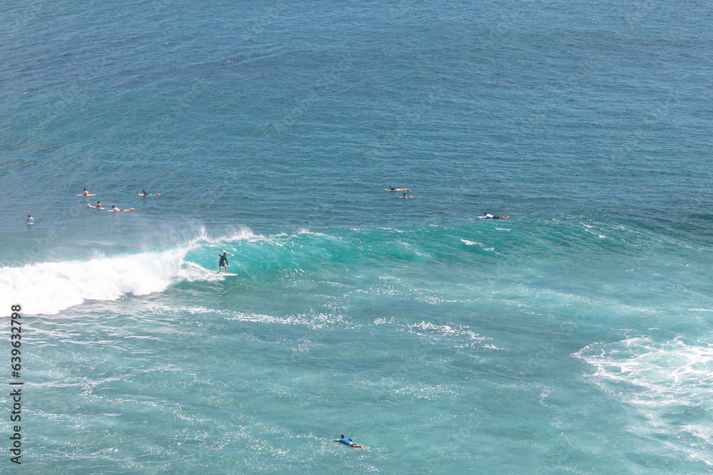 Surfing a nice left at Uluwatu, Bali, Indonesia Surfing a nice left at Uluwatu, Bali, Indonesia