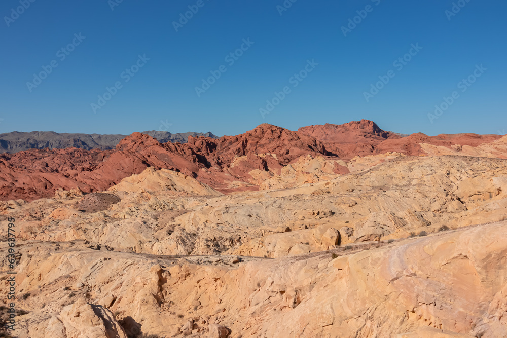 Scenic view of from Silica Dome viewpoint overlooking the Valley of Fire State Park in Mojave desert, Nevada, USA. Landscape of Aztek sandstone rock formations. Hot temperature in arid vegetation Scenic view of from Silica Dome viewpoint overlooking the Valley of Fire State Park in Mojave desert, Nevada, USA. Landscape of Aztek sandstone rock formations. Hot temperature in arid vegetation