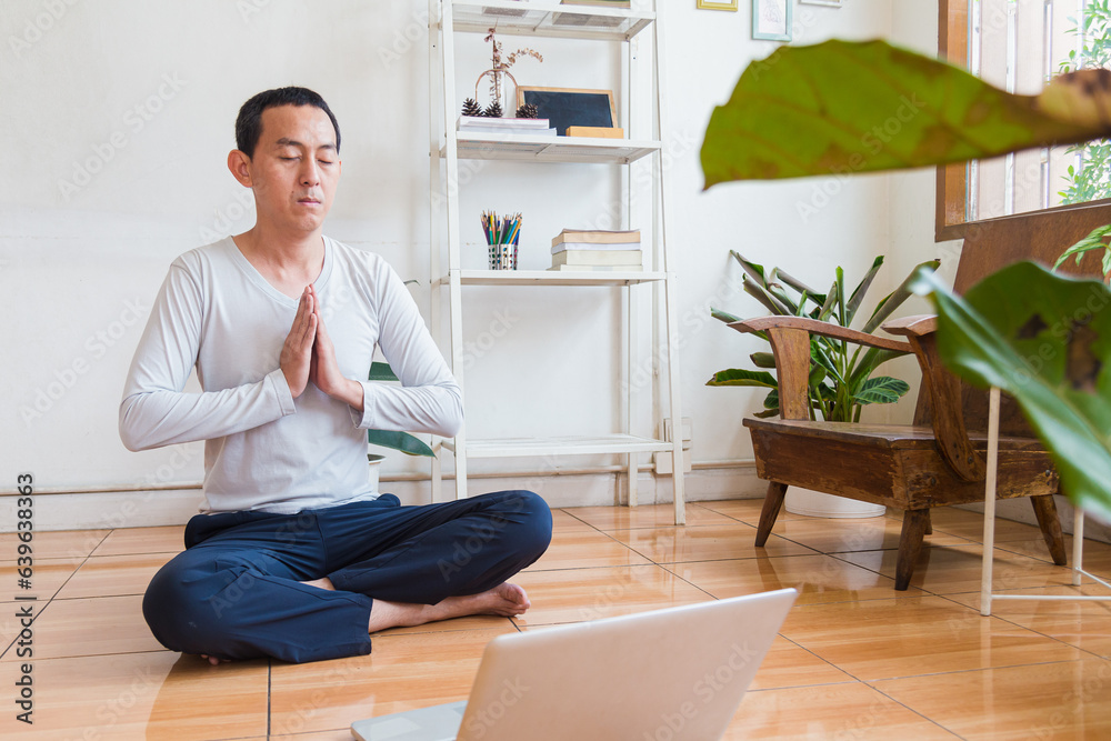 Meditation, zen asian man in relax, peace and mental health in house living room Meditation, zen asian man in relax, peace and mental health in house living room