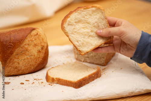 slices of bread being touch and hold for a person 
