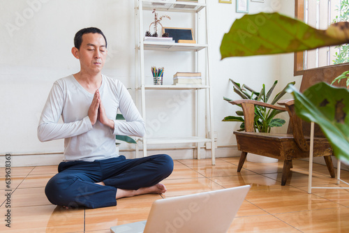 Meditation, zen asian man in relax, peace and mental health in house living room