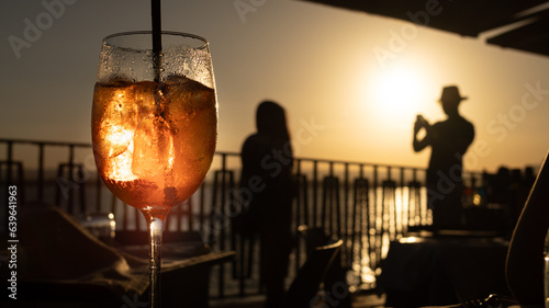silhouette of a person with a glass of cocktail
