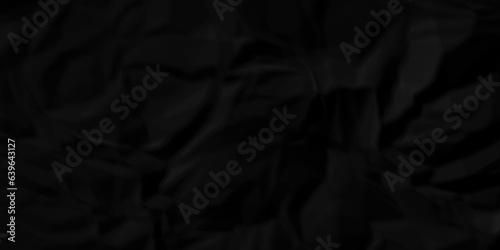 Dark crumple black paper wrinkled poster template ,blank glued creased paper texture background. black paper crumled backdrop background. used for cardboard and clarkboard.