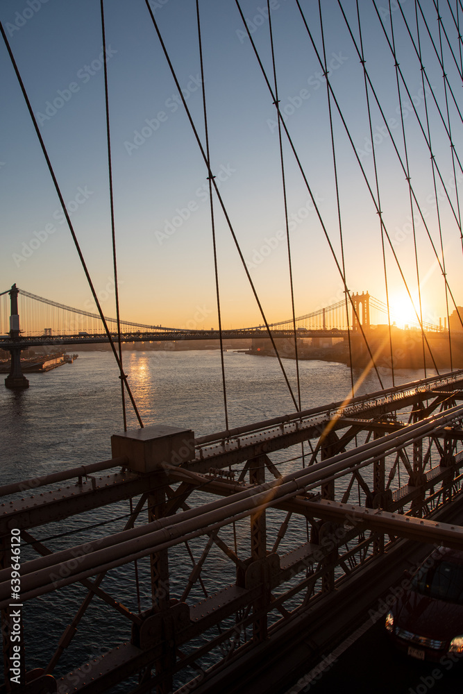 Sunrise over Brooklyn Bridge and Manhattan Bridge in New York City