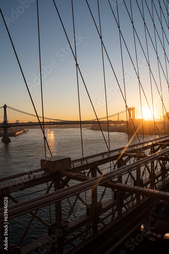 Fototapeta Naklejka Na Ścianę i Meble -  Sunrise over Brooklyn Bridge and Manhattan Bridge in New York City