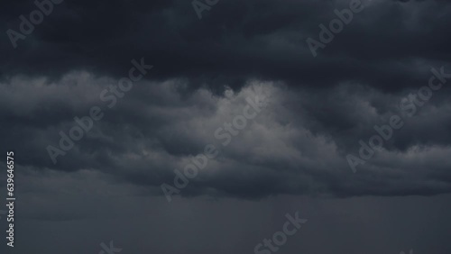 Dark stormy clouds background of natural weather effects photo