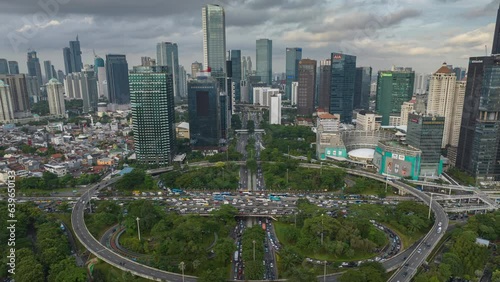 day time jakarta city downtown traffic street road junction aerial panorama 4k timelapse indonesia
