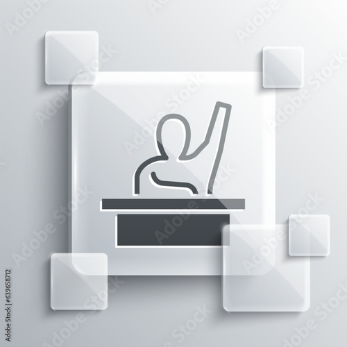 Grey Active male kid raising hand answering to teacher question icon isolated on grey background. An elementary student raises his hand. Square glass panels. Vector