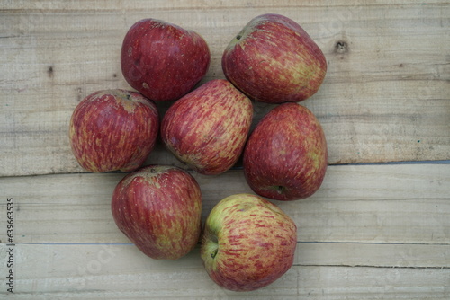 indian himachal apples , isolated on wooden background