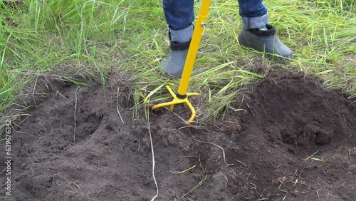 Process of plowing agricultural land using hand cultivator tool with pitchfork