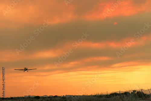Devastating wildfire in Alexandroupolis Evros Greece  Aerial firefighting waterbombing planes  smoke covered the sky  sunset colors