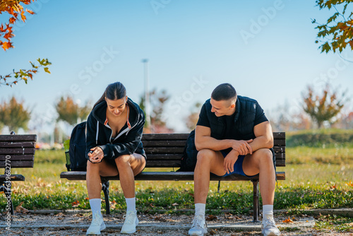 Two friends resting on a bench