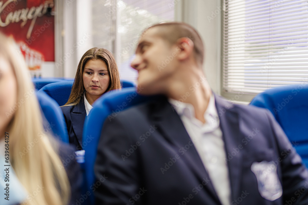 Student talking to his classmate in the back Student talking to his classmate in the back