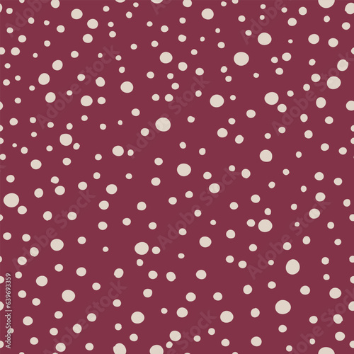 Cute retro-style pattern with red and off-white abstract polka dots. Adorable classical design with random chaotic dots in maroon and tan colors. A simple and romantic seamless vector pattern