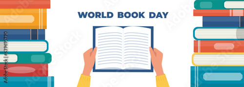 World book day. Hand holding open book. Stack of books and lettering. Designed to greeting or celebrate Book Day. Vector illustration.