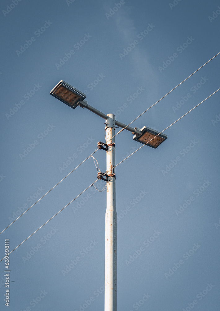 Street light pole on a blue sky. aesthetic pictures for quotes. Street light pole on a blue sky. aesthetic pictures for quotes.