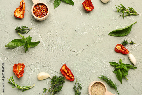 Frame made of fresh spices and herbs on grunge background