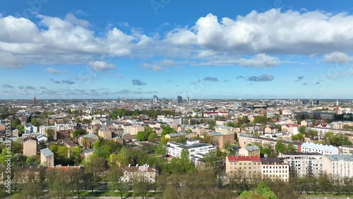 Aerial Riga top view famous Riga's Historic city Latvia in panoramatic spring season panorama sunrise blue sky clouds skyscrapers. Beautiful modern historical buildings monuments architecture houses photo
